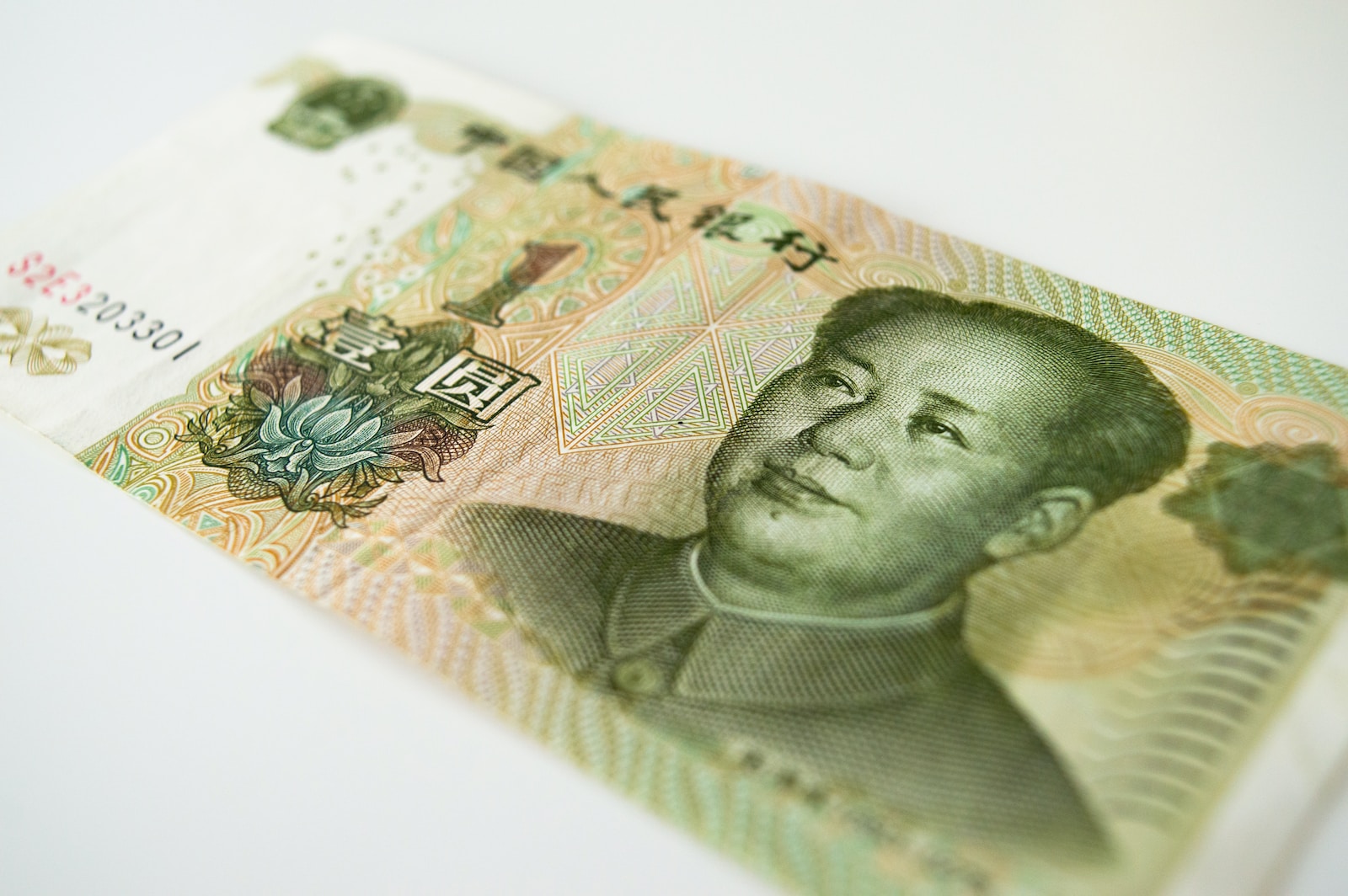 a close up of a bank note with a man's face on it