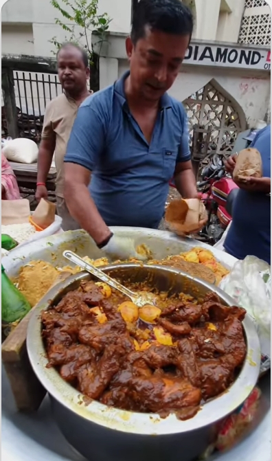 Spicy Chicken Jhal Muri is a popular Bengali street food.