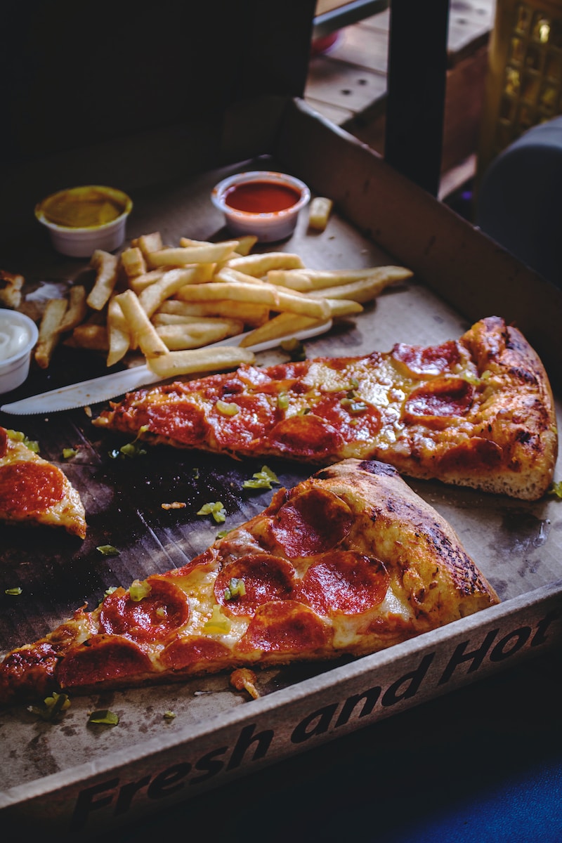 baked pepperoni pizza with French fries